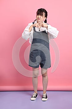asian woman in overalls casual clothes