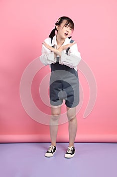 asian woman in overalls casual clothes