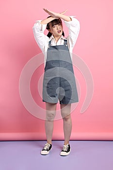 asian woman in overalls casual clothes