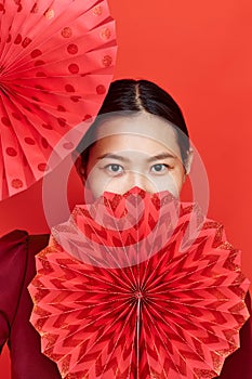 Asian woman with paper fans