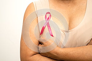 Asian woman patient checking and worry her breast, Breast Self Exam or BES, symbol of World Breast Cancer Day