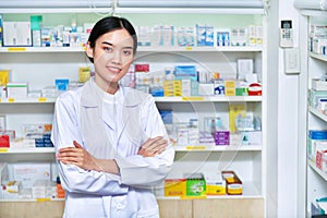 Asian woman pharmacist, chemist woman standing in pharmacy