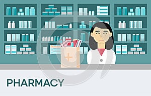 Asian woman pharmacist with short hair in drugstore with box medicament