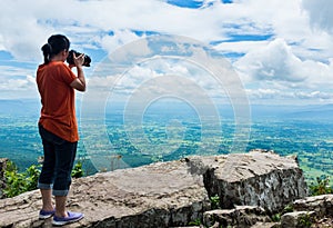 Asian woman photographed the beautiful view, outdoor on summer d