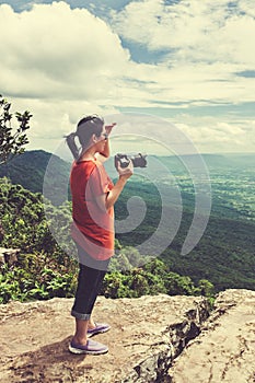 Asian woman photographed the beautiful view, outdoor on summer d
