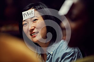 Asian Woman Playing Guessing Game