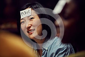 Asian Woman Playing Guessing Game photo