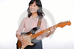 Asian woman playing a vintage sunburst electric guitar  on white background