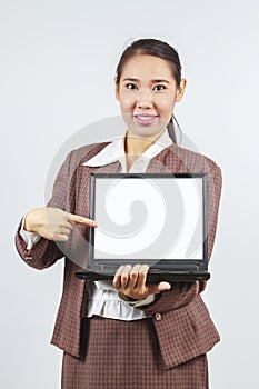 Asian woman pointing at her laptop