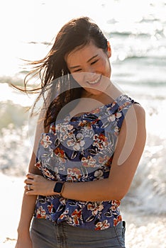 An Asian woman portrait on the beach with enjoy and happiness in Pattaya beach, Thailand