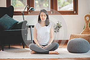 Asian woman practicing meditation