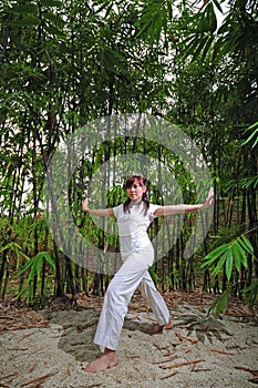 Asian Woman practising Yoga in Woods 2