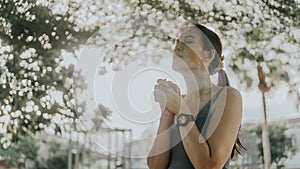 Asian woman prayed for the morning glow in the park