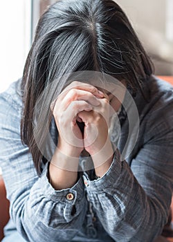 Asian woman prayer praying for christianity holy spirit belief, forgiveness on religion concept, or depressed person with anxiety