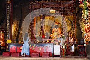 Asian Woman praying at a Chinese temple