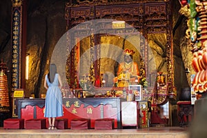 Asian Woman praying at a Chinese temple