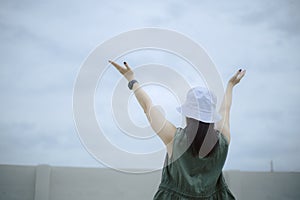 Asian woman praying morning outdoor, Hands folded in prayer concept for faith, spirituality and religion, Church services online