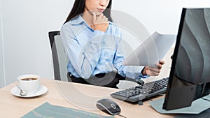 Asian woman programmer typing source code with computer pc for Developing program or application in her office