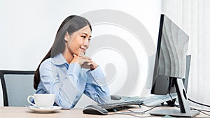 Asian woman programmer typing source code with computer pc for Developing program or application in her office