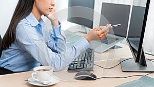 Asian woman programmer typing source code with computer pc for Developing program or application in her office