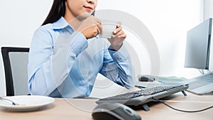 Asian woman programmer typing source code with computer pc for Developing program or application in her office