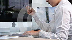 Asian Woman programmer typing source codes Programming On Computer in office, freelance web developer concept