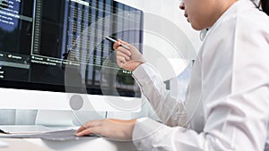 Asian Woman programmer typing source codes Programming On Computer in office, freelance web developer concept