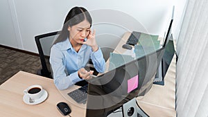 Asian woman Programming working with computer and typing data code to developing program at table In Office, technology concept