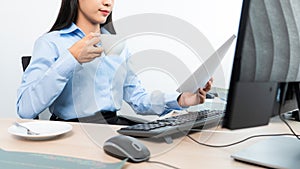 Asian woman Programming working with computer and typing data code to developing program at table In Office, technology concept