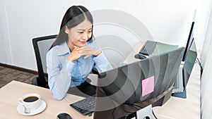 Asian woman Programming working with computer and typing data code to developing program at table In Office, technology concept