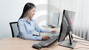 Asian woman Programming working with computer and typing data code to developing program at table In Office, technology concept