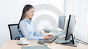 Asian woman Programming working with computer and typing data code to developing program at table In Office, technology concept
