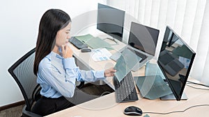 Asian woman Programming working with computer and typing data code to developing program at table In Office, technology concept