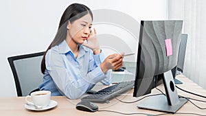 Asian woman Programming working with computer and typing data code to developing program at table In Office, technology concept