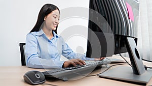 Asian woman Programming working with computer and typing data code to developing program at table In Office, technology concept