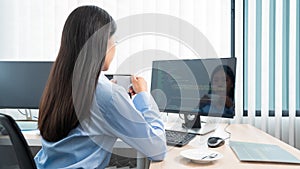 Asian woman Programming working with computer and typing data code to developing program at table In Office, technology concept
