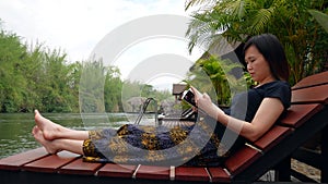 Asian woman reading a book