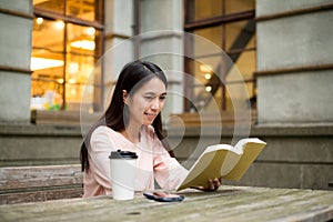 Asian Woman reading book