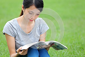 Asian woman reading book