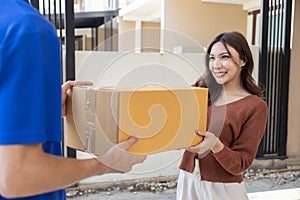 Asian Woman Received a Caton Parcel Box From a Delivery Man