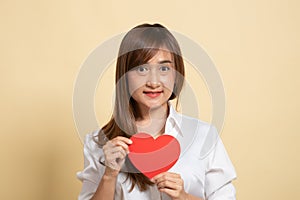 Asian woman with red heart