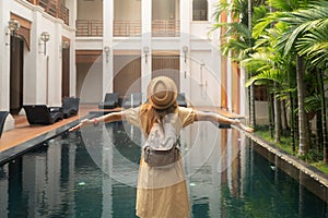 Asian woman relax in resort and swimming pool in Hotel in Chiangmai