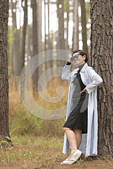 Asian woman relaxing emotion toothy smiling in pine forest