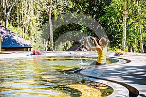 Asian woman relaxing in the Pool hot springs, Hot Springs In National Park And Natural Mineral Water