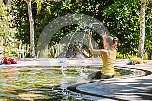 Asian woman relaxing in the Pool hot springs, Hot Springs In National Park And Natural Mineral Water