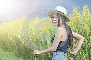 Asian woman riding bicycle