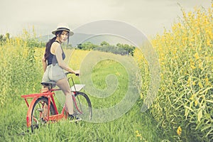 Asian woman riding bicycle