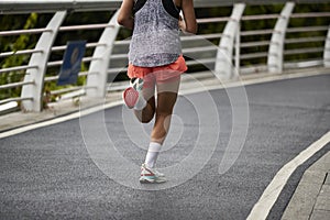 asian woman running outdoors