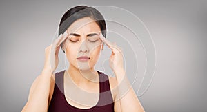 Asian woman`s migraine severely, suffering korean,chinese girl isolated on grey background, healh care concept