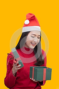 Asian Woman With Santa Claus  Open Her Christmas Present Box near the Christmas Tree